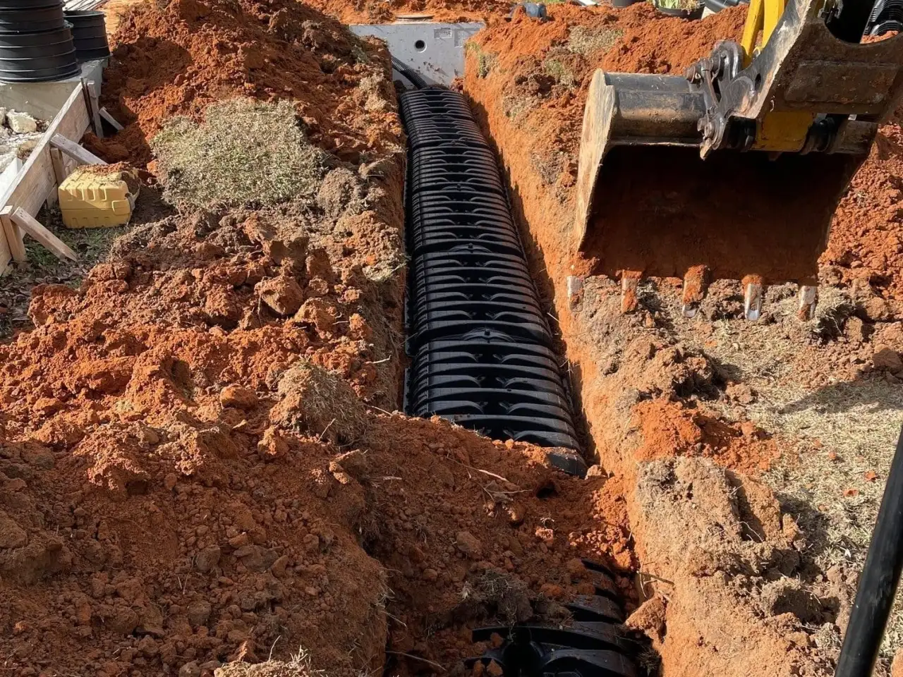 New chamber field lines in a trench next to a new septic tank