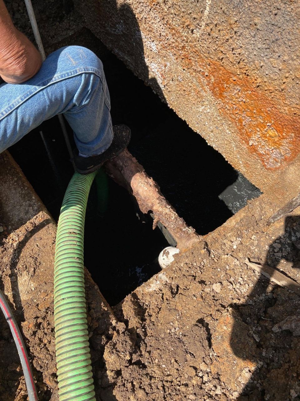 Deep Septic Tank Under a Backyard Deck Pumped – photo 2